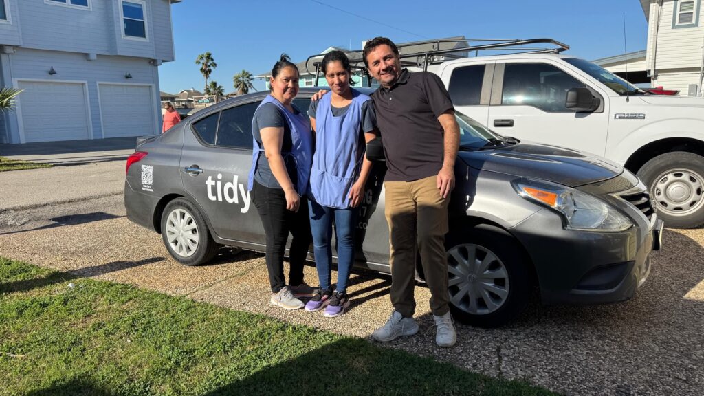 Photo of Violet Team outside a Home.