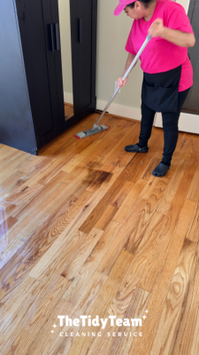 House cleaner cleaning floor during a move out cleaning